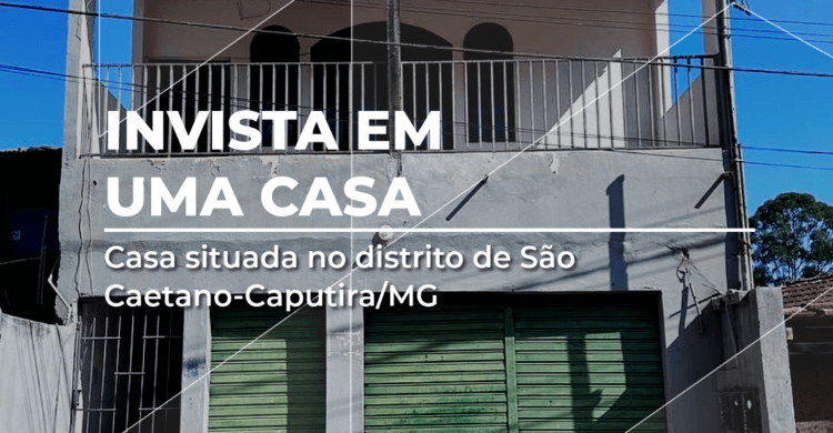 Casa com ponto comercial à venda no distrito de São Caetano, Caputira/MG, fachada com sacada, portões verdes e cobertura ampla.