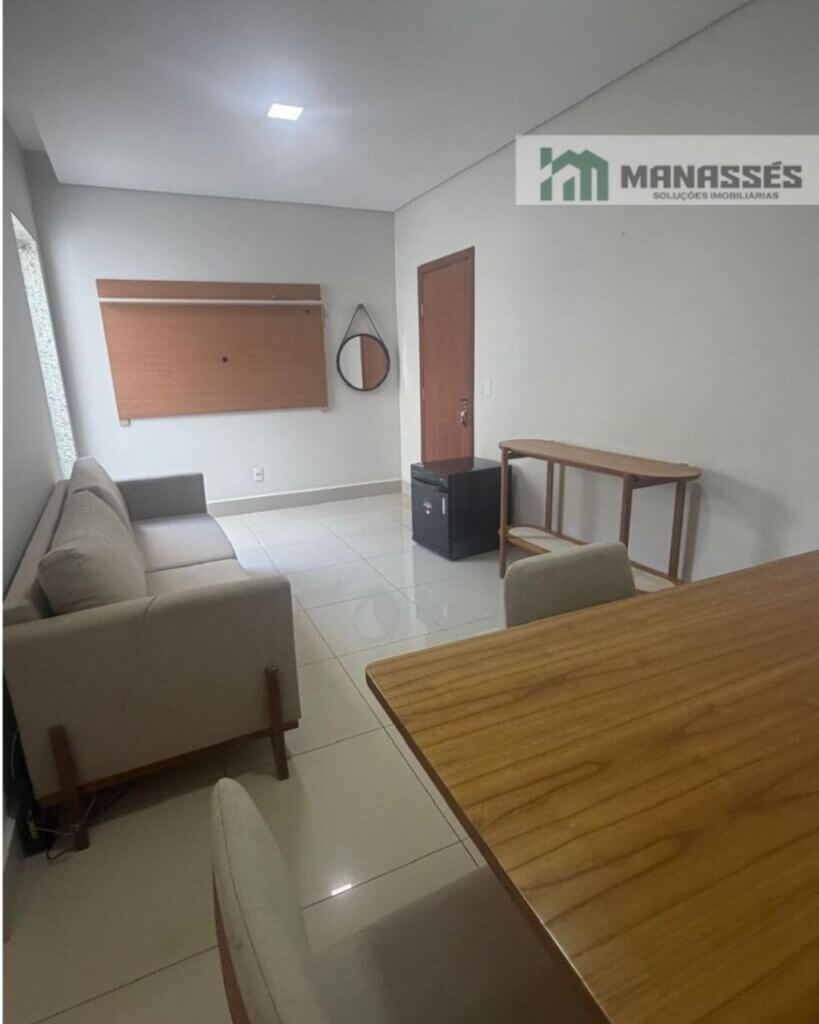 Sala de estar e jantar integrada com sofá, mesa de refeições, piso em porcelanato e acabamento moderno em imóvel residencial à venda em Manhuaçu