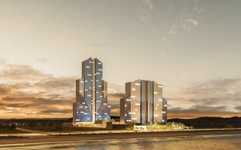 Renderização do Taj Home Resort com duas torres residenciais modernas iluminadas ao entardecer, em área próxima ao litoral e cercada por paisagismo.